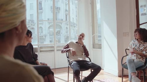 Adults Having Group Discussion in a Bright Room