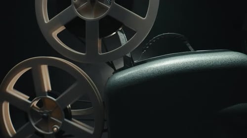 Vintage Film Projector Reels in a Dark Room