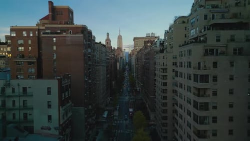 Aerial Ascending Footage of Street and Surrounding Buildings in Metropolis