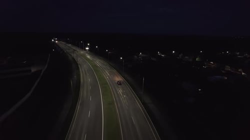 Aerial View of the Movement of Cars on the Outskirts of the City and on the Double Bridge Over the