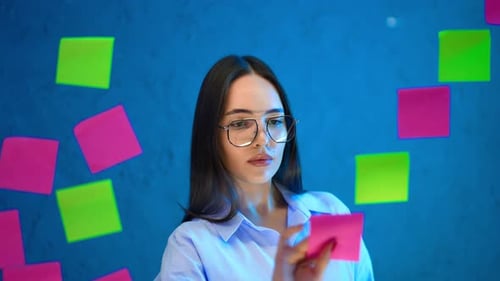 Woman with Sticky Notes Brainstorming Ideas