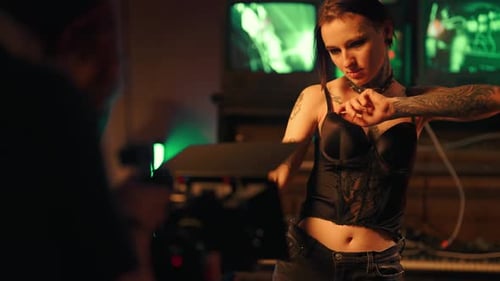 Professional Shooting in Studio Cameraman and Actress Playing Role of Rockstar Young Adult Woman
