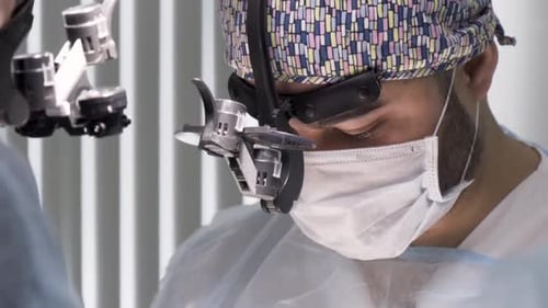 A Dedicated Surgeon Stays Focused During a Complex Procedure Ensuring Patient Safety and Care