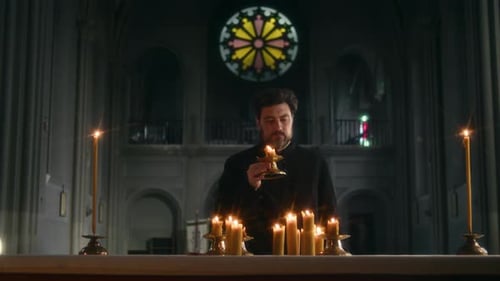 Priest Putting Candle on Altar Praying in Catholic Church