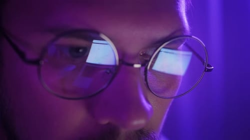 Close Up of Adult Using Computer at Night