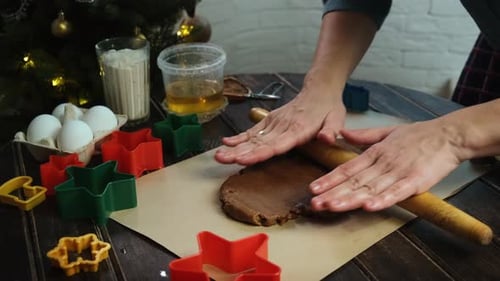 Rolling out gingerbread dough with a rolling pin