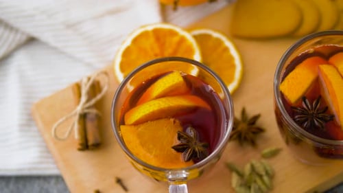 Christmas and Seasonal Drinks Concept - Glasses of Hot Mulled Wine With