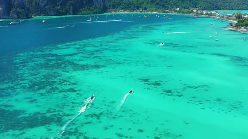 Aerial view of iconic tropical turquoise water Pileh Lagoon surrounded by limestone cliffs, Phi Phi