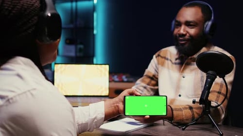Guest Reacting to Videos on Mockup Mobile Phone During Online Comedy Show