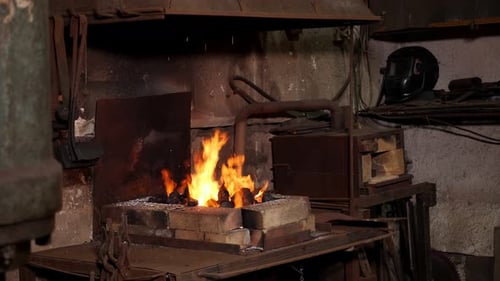 Burning Fire in Furnace at Forge Workshop Blacksmith Equipment Concept