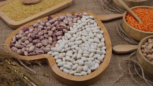 Colorful Variety of Dried Legumes in Wooden Bowls