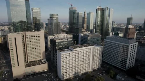 Aerial orbit over the downtown of a modern capital city with skyscrapers in the business district