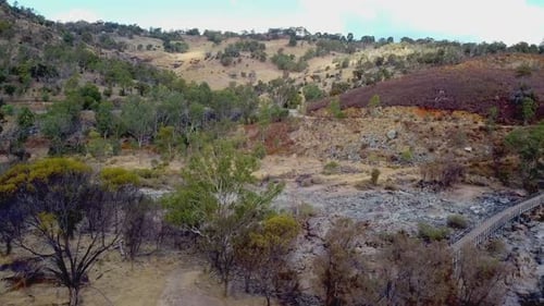 Aerial reverse view near Bells Rapids bridge with dry Swan River