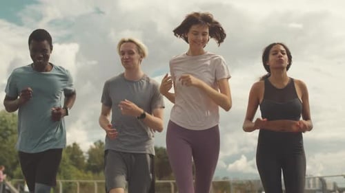 Group of Friends Jogging Together Outside