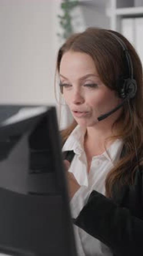 Beautiful Girl Consultant with Smile Answering Clients Questions in Virtual Call Center Female