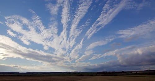 Amazing White Clouds Over the Field