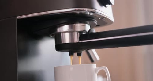 HomeEspresso Making Pouring Coffee Stream From Machine Into Cup