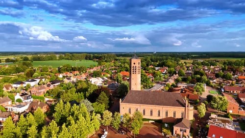 Flying closer to the Saint Lawrence Church with a freestanding clock tower.