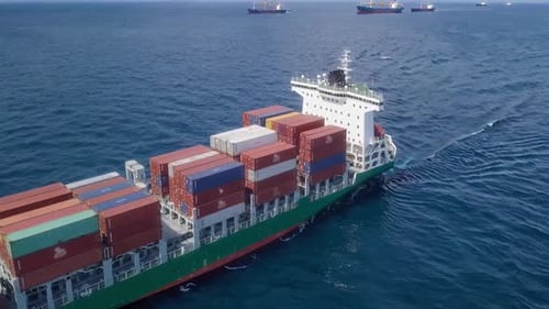 Aerial View of Cargo Ship Sailing on Ocean