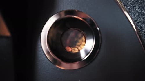 Coffee Beans Swirling in Metal Container
