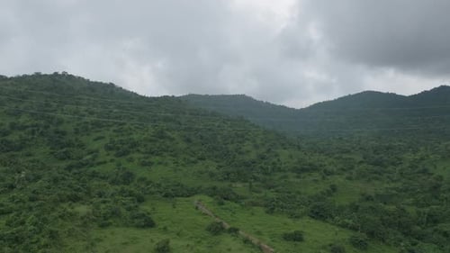 Green Mountain Landscape with Power Lines Aerial View