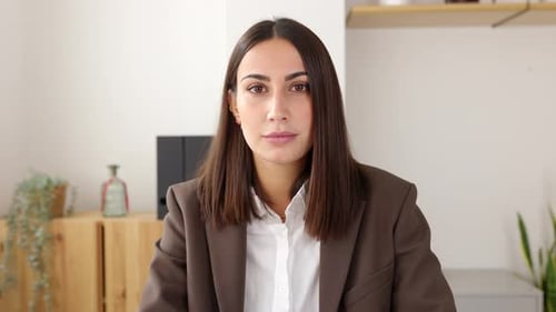 Woman in Blazer Talking During Video Call