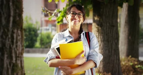 student relaxes by reading and studying a pleasant topic at park. connection concept and tranquili