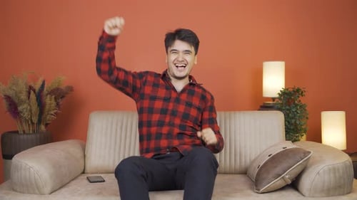 Happy man dancing to the camera.
