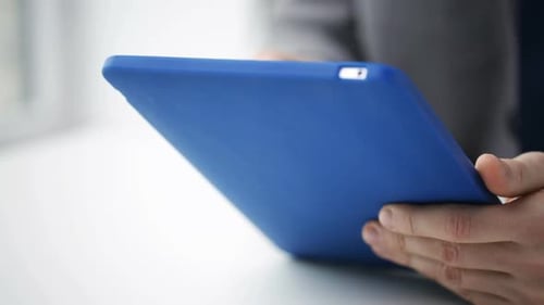 Closeup Of Businessman Hands With Tablet Pc Computer At Office