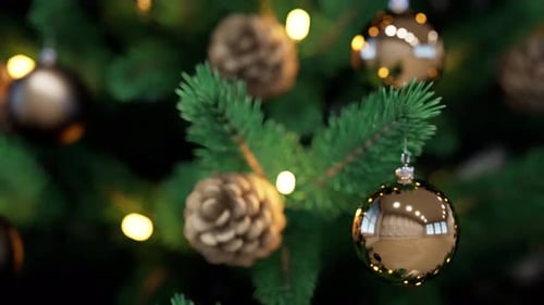 Close Up View Of Christmas Tree Decorations With Lights And Pinecones