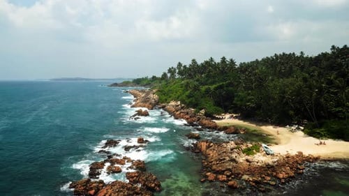 Aerial Reveals Rugged Coastline Crystalclear Azure Waves Crashing Against Intermixed Sandy Coves