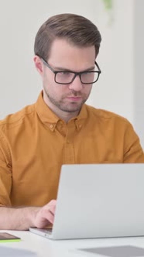 Young Man Closing Laptop Going Away, Vertical Video