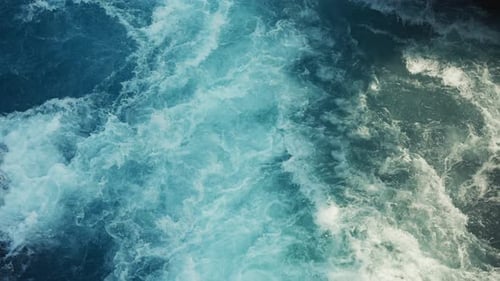 Static camera of a beautiful aqua blue river with raging white water rapids.
