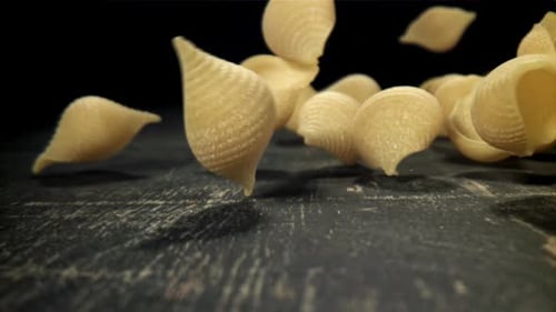 Dry Pasta Falls on the Table Filmed on a Highspeed Camera at 1000 Fps