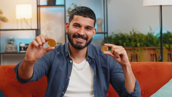 Indian Freelancer Man Stock Trader Holding Two Golden Bitcoins BTC ...