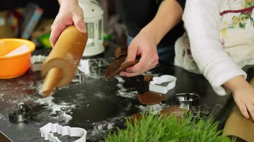 Mother and daughter preparing gingerbread cookies for christmas