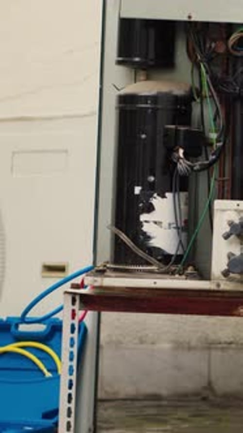 Open Air Conditioning Unit with Bucket and Tubing