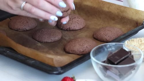 Woman Preparing Delicious Chocolate Cookies for Baking