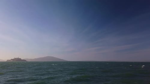 Gimbal wide panning shot of Alcatraz Island from San Francisco, California. 4K at 60 FPS.