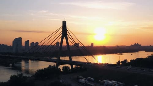 Urban Cityscape with River Bridge with Moderate Car Traffic