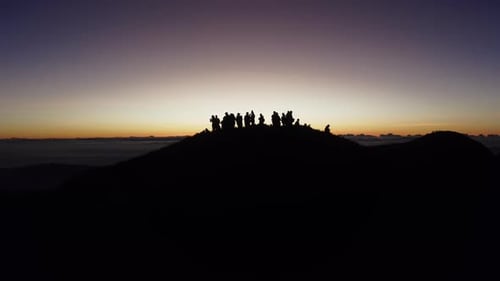 Aerial video of Mount Pulag at sunset with people in the background, the third highest mountain