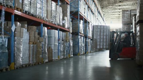 Forklift Loader is Moving Cargo Goods in Logistic Warehouse