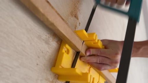 Vertical Video of a Man Cutting Wooden Board