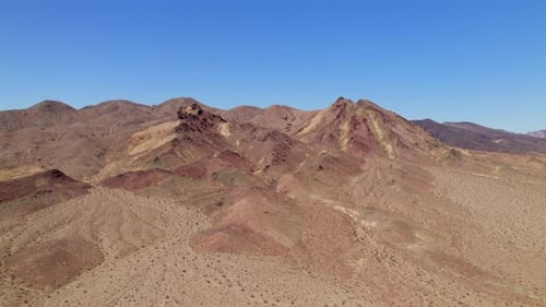 Aerial Arid Hill Desert Landscape In California. Descending Shot, Tilt Up