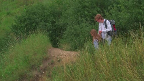 Young Couple Hiking in Forested Rural Environment