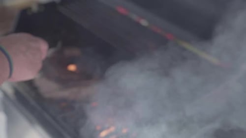 Steaks Cooking on a Grill with Flames