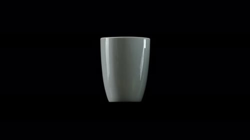 Rotating White Coffee Mug on Black Studio Background
