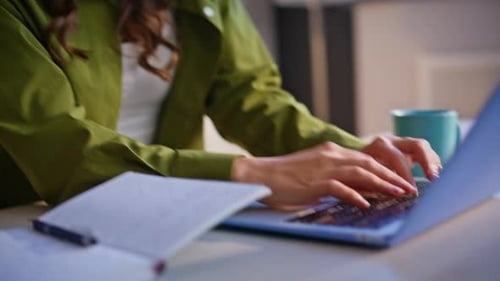 Multitasking Employee Typing Keyboard Laptop Talking Cellphone at Office Closeup