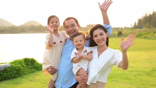 Happy Family Having Fun with Activities Together in Park on Weekend