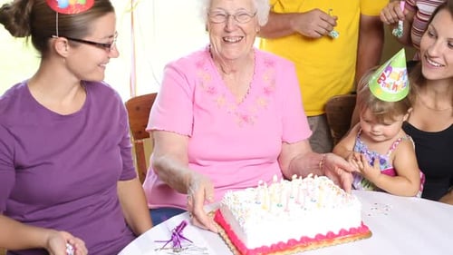 Family Celebrates Birthday with Cake and Confetti